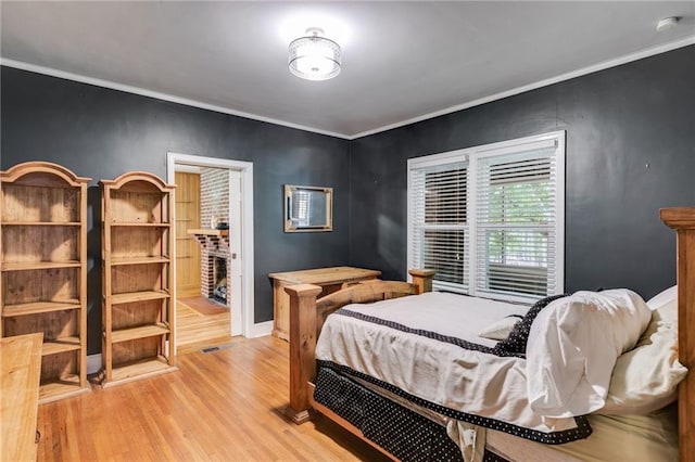 407 E College St E, Bowdon, GA 30108 - bedroom featuring light wood-style flooring and crown molding
