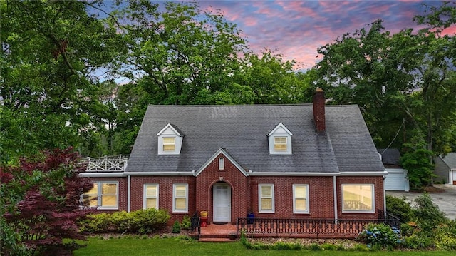407 E College St E, Bowdon, GA 30108 - view of front facade featuring brick siding, a chimney, and a yard