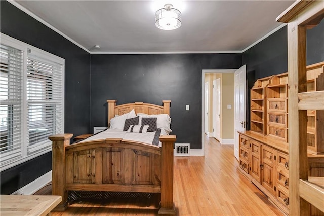 407 E College St E, Bowdon, GA 30108 - bedroom featuring light wood-type flooring and ornamental molding