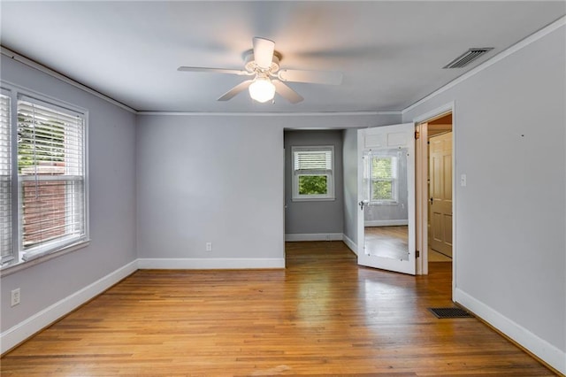 407 E College St E, Bowdon, GA 30108 - unfurnished room with light wood-style floors, a ceiling fan, and ornamental molding