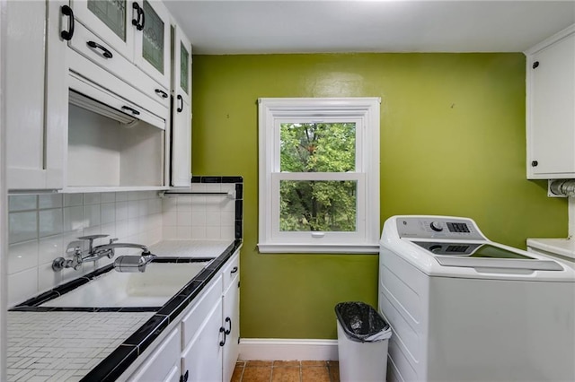 407 E College St E, Bowdon, GA 30108 - washroom featuring washer / dryer, cabinet space, and tile patterned flooring