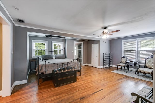 407 E College St E, Bowdon, GA 30108 - bedroom featuring light wood-style flooring, ornamental molding, and a ceiling fan