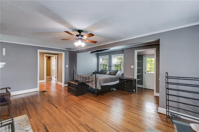 407 E College St E, Bowdon, GA 30108 - bedroom featuring light wood-type flooring, ornamental molding, and ceiling fan