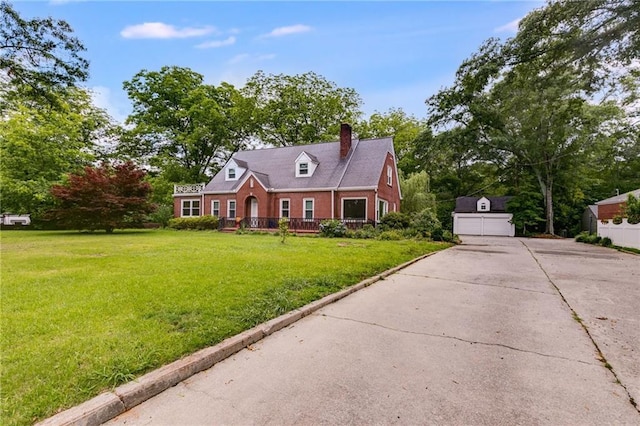 407 E College St E, Bowdon, GA 30108 - cape cod home with a chimney, a front yard, brick siding, a garage, and an outbuilding