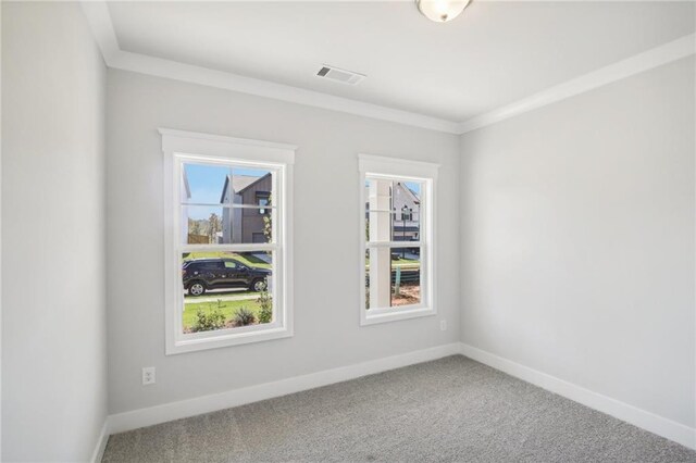 spare room with carpet and baseboards