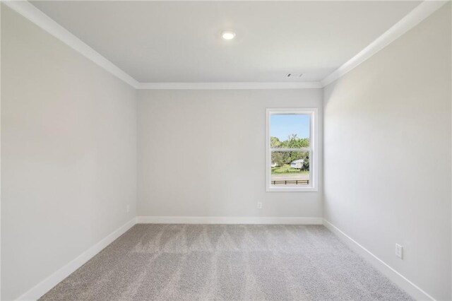 unfurnished room with crown molding, baseboards, light colored carpet, and recessed lighting