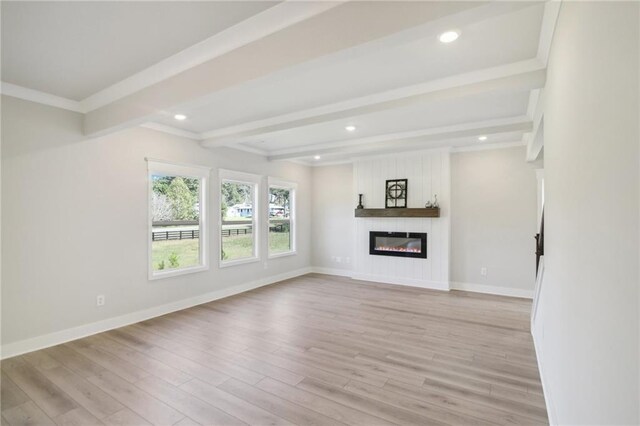 unfurnished living room featuring beam ceiling, light wood-type flooring, a fireplace, recessed lighting, and baseboards
