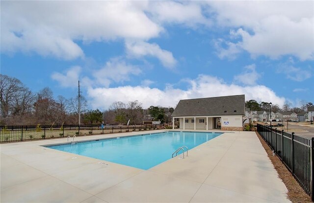 community pool with a patio area