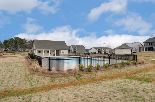 community pool with a residential view