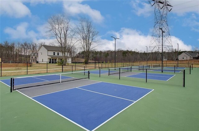 view of tennis court with community basketball court
