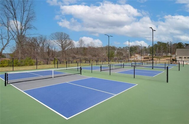 view of tennis court with community basketball court