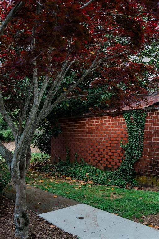 view of property exterior featuring brick siding