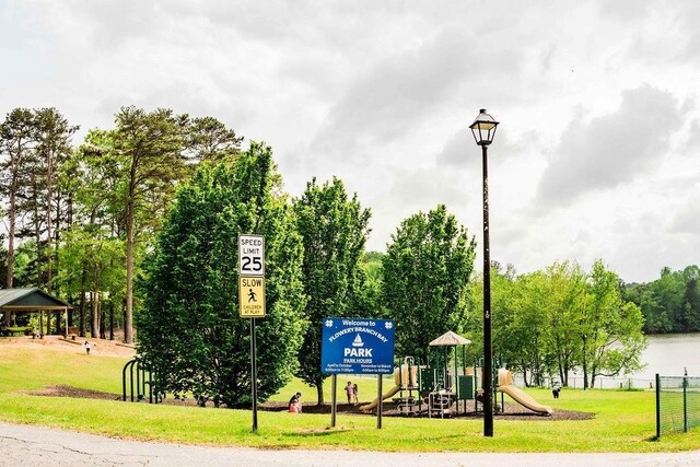 view of property's community featuring a lawn and a gazebo