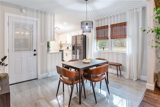 dining space with baseboards
