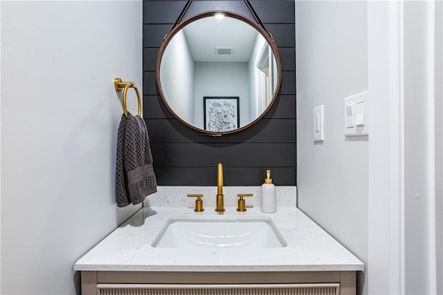 bathroom featuring visible vents and vanity