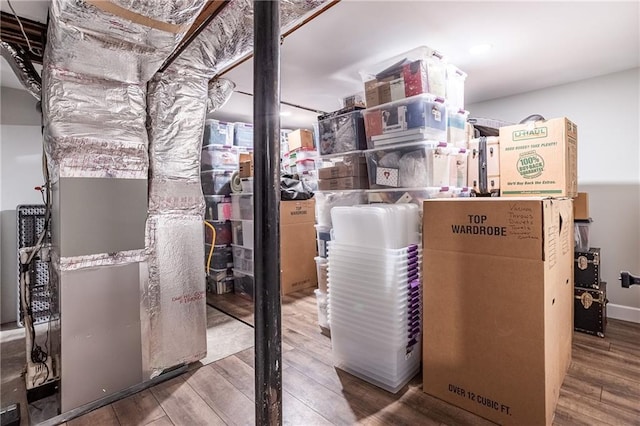 utility room featuring heating unit