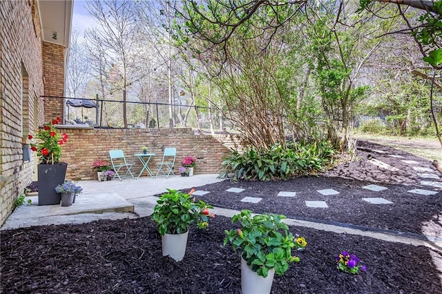 view of yard featuring fence and a patio
