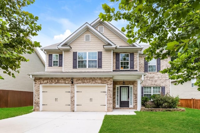 craftsman-style house with a front yard and a garage