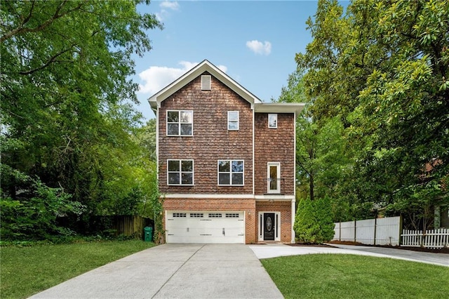 view of front of property with a garage, brick siding, fence, driveway, and a front yard