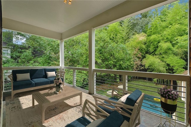 wooden deck featuring an outdoor hangout area