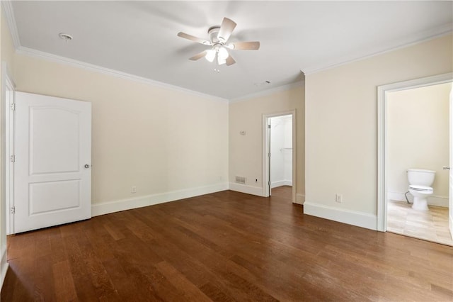 unfurnished bedroom with ornamental molding, ensuite bath, baseboards, and wood finished floors