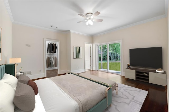 bedroom with wood finished floors, visible vents, baseboards, access to exterior, and ornamental molding