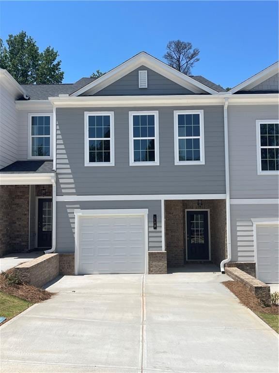 119 Greenview Ct Unit 1303, Homer, GA 30547 - view of front of house featuring brick siding, driveway, and an attached garage