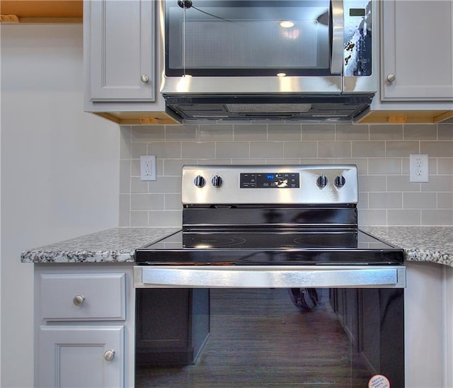 119 Greenview Ct Unit 1303, Homer, GA 30547 - detailed view of stainless steel appliances, decorative backsplash, and light stone counters
