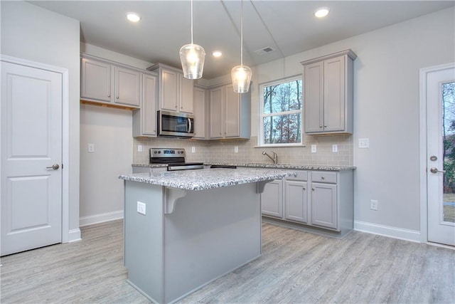 119 Greenview Ct Unit 1303, Homer, GA 30547 - kitchen with stainless steel appliances, gray cabinets, light wood finished floors, tasteful backsplash, and recessed lighting