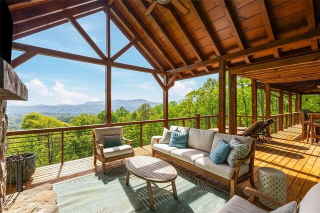 851 N Moreland Dr N, Blue Ridge, GA 30513 - sunroom with beamed ceiling, outdoor lounge area, a mountain view, and a wealth of natural light
