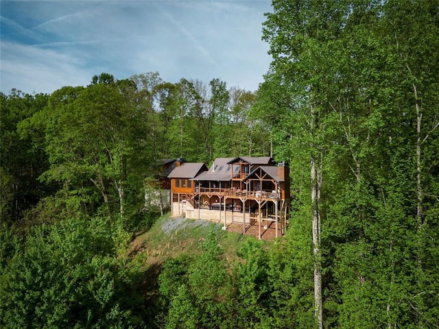 851 N Moreland Dr N, Blue Ridge, GA 30513 - rear view of property with a forest view, a wooden deck, and a chimney