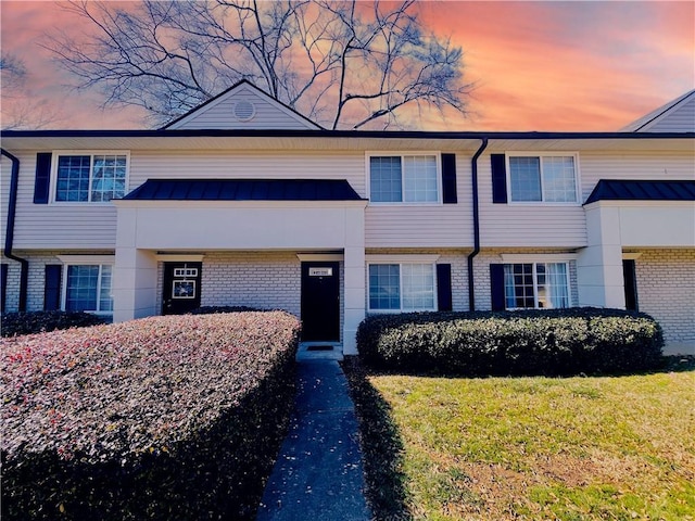 view of front of house with a yard