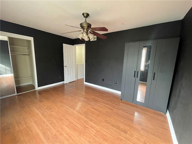 unfurnished bedroom featuring light hardwood / wood-style floors and ceiling fan