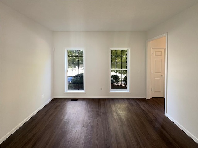 empty room featuring dark hardwood / wood-style floors