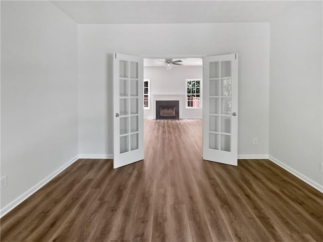 200 Eagle Glen Ct, Woodstock, GA 30189 - unfurnished room with french doors, ceiling fan, dark wood-style floors, and baseboards
