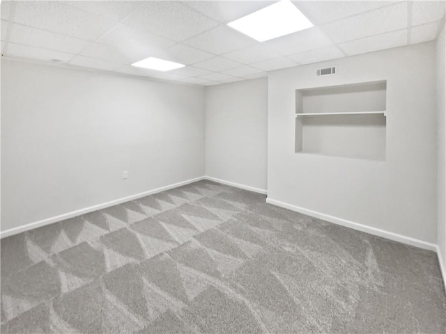 200 Eagle Glen Ct, Woodstock, GA 30189 - carpeted empty room with a paneled ceiling, built in features, and baseboards