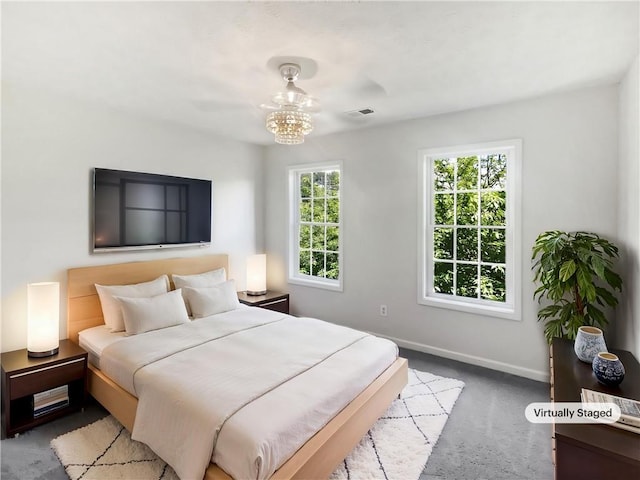 200 Eagle Glen Ct, Woodstock, GA 30189 - bedroom with baseboards, carpet, and a chandelier