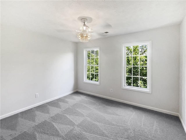 200 Eagle Glen Ct, Woodstock, GA 30189 - spare room with baseboards, carpet floors, and a chandelier