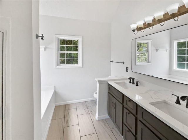200 Eagle Glen Ct, Woodstock, GA 30189 - full bath with toilet, double vanity, a bathtub, and baseboards