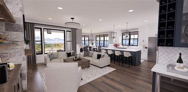 living room featuring crown molding and dark hardwood / wood-style flooring