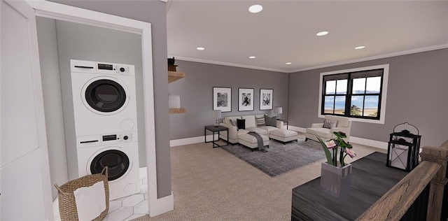 interior space featuring ornamental molding and stacked washer / dryer