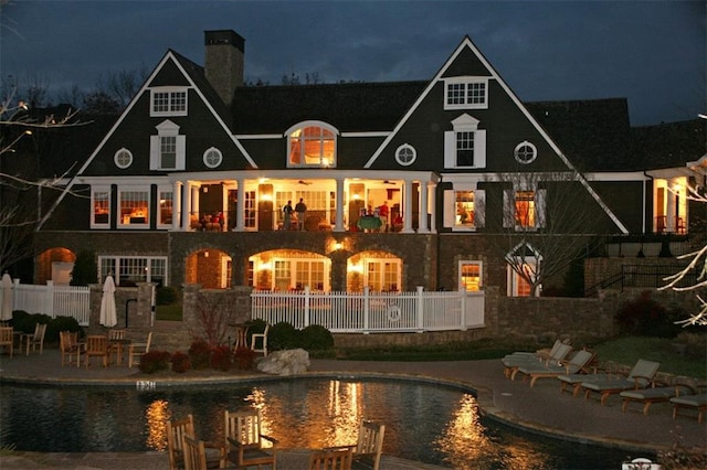 back house at night with a patio