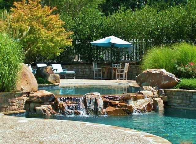 view of pool featuring pool water feature