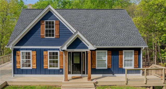 back of property featuring covered porch