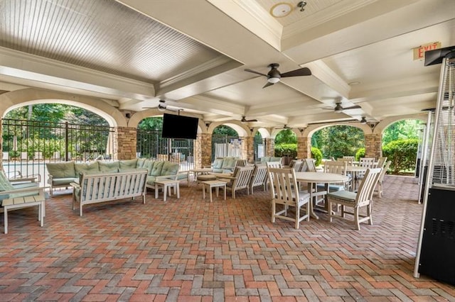 view of patio / terrace featuring an outdoor hangout area, ceiling fan, outdoor dining area, and fence