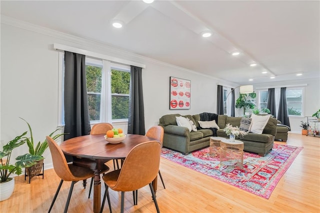 living area featuring crown molding, recessed lighting, light wood-style flooring, and a wealth of natural light