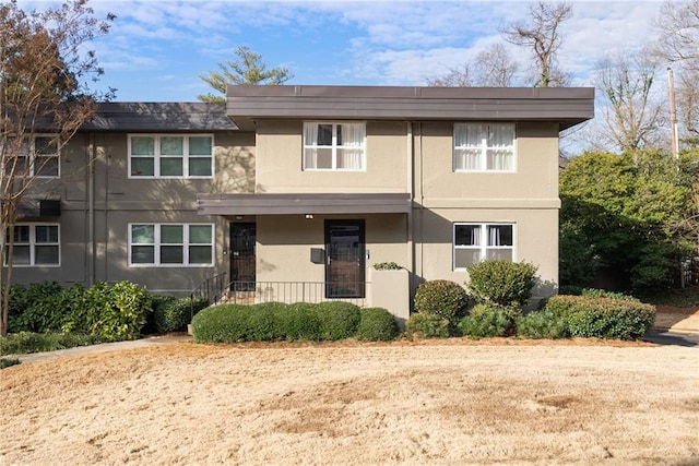 view of front of property with covered porch and stucco siding