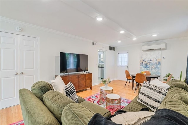 living area featuring recessed lighting, visible vents, a wall unit AC, and ornamental molding