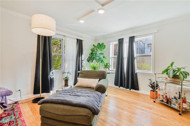 sitting room featuring crown molding, recessed lighting, baseboards, and wood finished floors