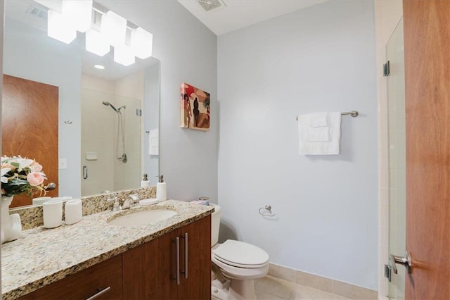 1253 Caroline St NE, Atlanta, GA 30307 - bathroom featuring a stall shower, tile patterned flooring, toilet, and vanity